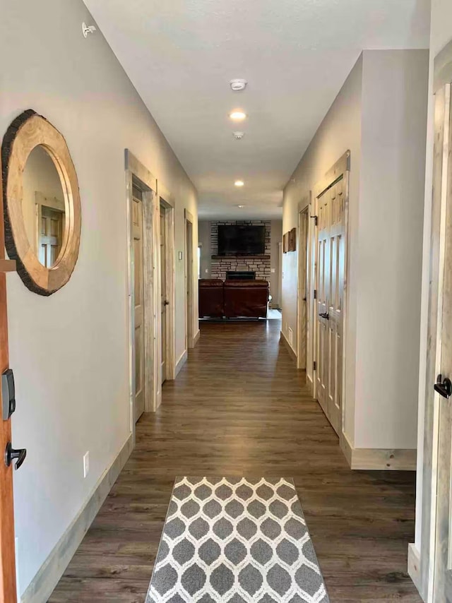 240 Chateau Cove Dr, Branson, MO 65616 - corridor with baseboards, dark wood-style flooring, and recessed lighting