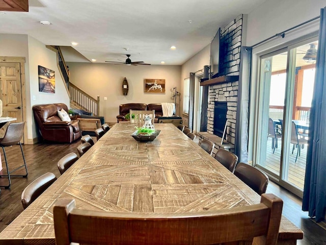 240 Chateau Cove Dr, Branson, MO 65616 - dining room with a ceiling fan, dark wood-style floors, a fireplace, stairs, and recessed lighting