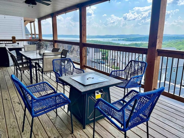 240 Chateau Cove Dr, Branson, MO 65616 - deck featuring a water view, a ceiling fan, and outdoor dining space