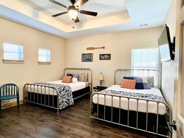 240 Chateau Cove Dr, Branson, MO 65616 - bedroom with a raised ceiling, wood finished floors, and ceiling fan