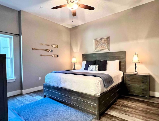 240 Chateau Cove Dr, Branson, MO 65616 - bedroom with wood finished floors, baseboards, and ceiling fan