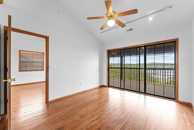 160 Village Trl, Indian Point, MO 65616 - spare room featuring hardwood / wood-style floors, ceiling fan, high vaulted ceiling, baseboards, and track lighting