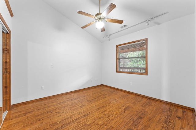 160 Village Trl, Indian Point, MO 65616 - unfurnished room with rail lighting, wood finished floors, lofted ceiling, ceiling fan, and baseboards