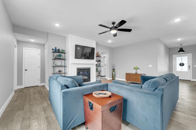 1682 Vicksburg Psge, Republic, MO 65738 - living area with baseboards, light wood finished floors, a ceiling fan, a large fireplace, and recessed lighting