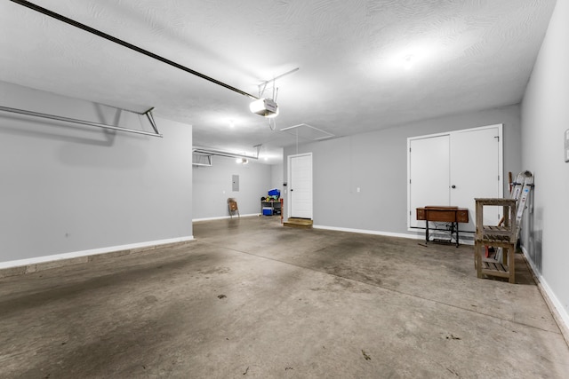 1682 Vicksburg Psge, Republic, MO 65738 - garage featuring a garage door opener and baseboards