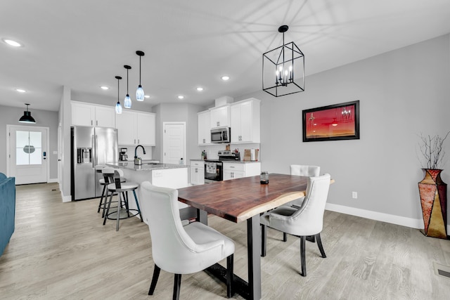 1682 Vicksburg Psge, Republic, MO 65738 - dining room with baseboards, light wood-style floors, recessed lighting, and a chandelier