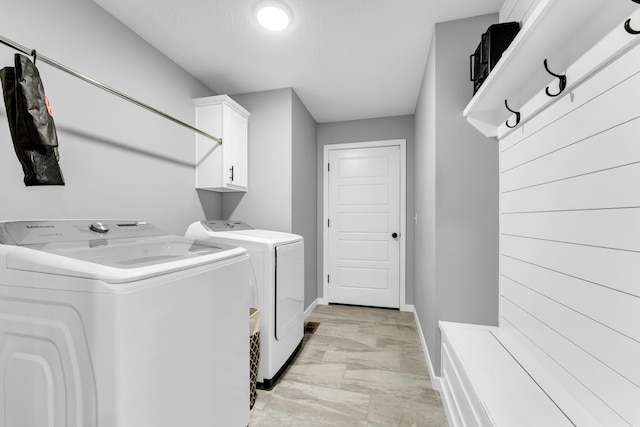 1682 Vicksburg Psge, Republic, MO 65738 - laundry area featuring washer and dryer, cabinet space, and baseboards