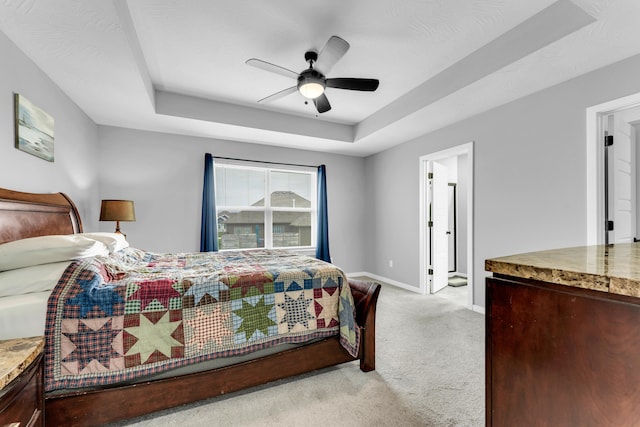 1682 Vicksburg Psge, Republic, MO 65738 - bedroom with light colored carpet, a tray ceiling, baseboards, and ceiling fan