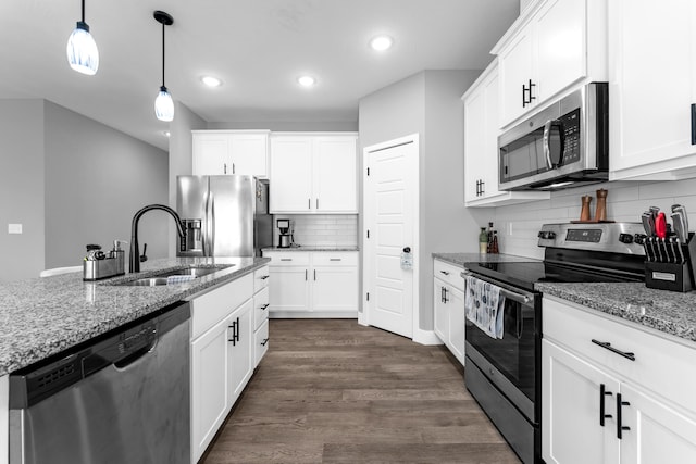 1682 Vicksburg Psge, Republic, MO 65738 - kitchen with appliances with stainless steel finishes, a sink, tasteful backsplash, recessed lighting, and hanging light fixtures