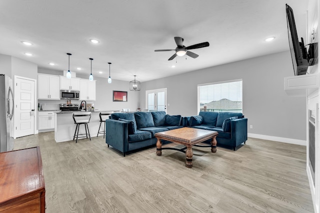 1682 Vicksburg Psge, Republic, MO 65738 - living room with ceiling fan, recessed lighting, light wood-type flooring, and baseboards