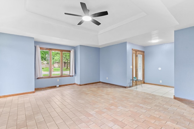 1007 Bryce Ln, Nixa, MO 65714 - empty room with a raised ceiling, baseboards, and ceiling fan