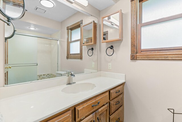 1007 Bryce Ln, Nixa, MO 65714 - full bathroom featuring a shower with door and vanity