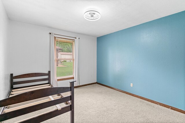 1007 Bryce Ln, Nixa, MO 65714 - unfurnished bedroom featuring carpet floors and baseboards