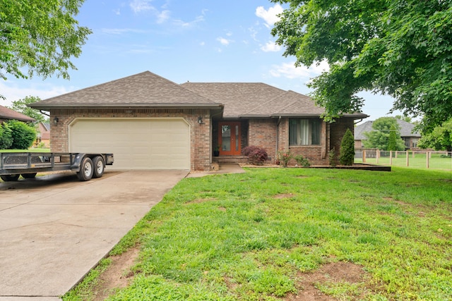 1007 Bryce Ln, Nixa, MO 65714 - ranch-style home featuring a garage, driveway, roof with shingles, and brick siding