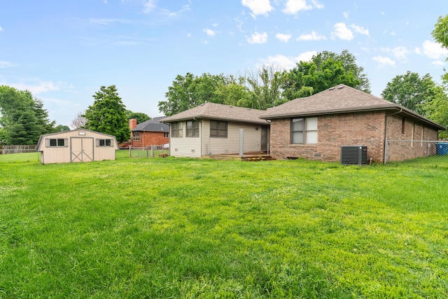 1007 Bryce Ln, Nixa, MO 65714 - back of house with brick siding, cooling unit, and roof with shingles