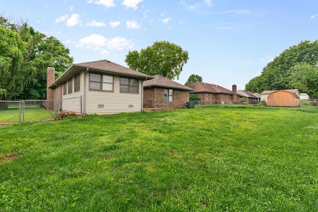 1007 Bryce Ln, Nixa, MO 65714 - back of house featuring a gate, central AC, and a chimney
