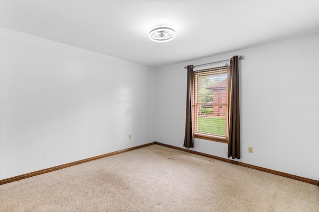 1007 Bryce Ln, Nixa, MO 65714 - unfurnished room featuring light carpet and baseboards