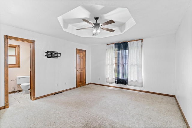 1007 Bryce Ln, Nixa, MO 65714 - unfurnished bedroom with carpet, a tray ceiling, and baseboards