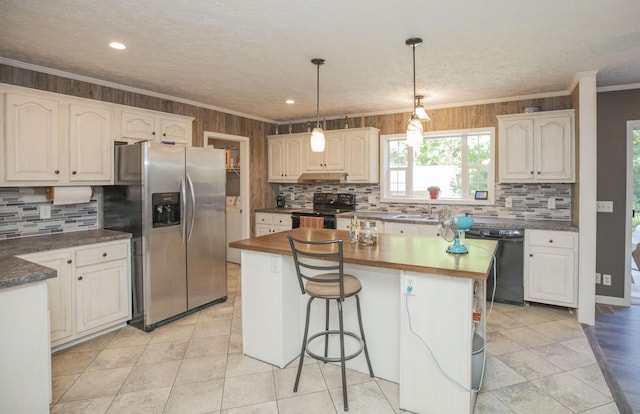 4857 S 101st Rd, Bolivar, MO 65613 - kitchen featuring black appliances, crown molding, tasteful backsplash, a center island, and a breakfast bar area