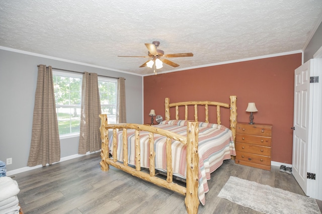 4857 S 101st Rd, Bolivar, MO 65613 - bedroom featuring wood finished floors, baseboards, a textured ceiling, crown molding, and ceiling fan