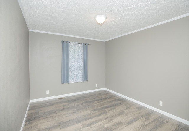 4857 S 101st Rd, Bolivar, MO 65613 - unfurnished room with wood finished floors, a textured ceiling, and baseboards