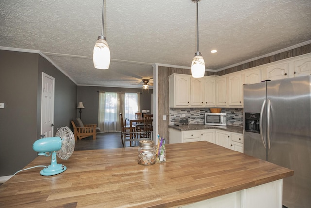 4857 S 101st Rd, Bolivar, MO 65613 - kitchen featuring stainless steel appliances, wooden counters, ceiling fan, a textured ceiling, and crown molding