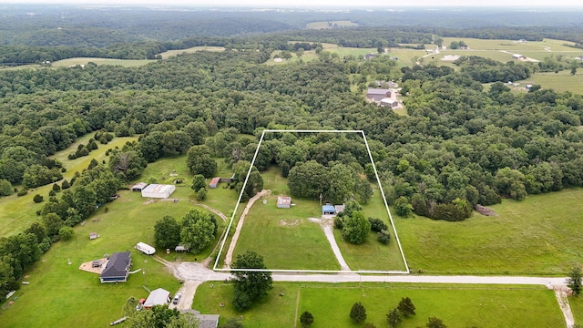 223 Harvest Dr, Rogersville, MO 65742 - overview of rural landscape featuring property parcel outlined and a heavily wooded area