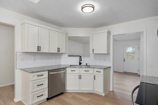 511 W Chestnut Rd, Nixa, MO 65714 - kitchen featuring dishwasher, a sink, light wood-type flooring, decorative backsplash, and light stone countertops