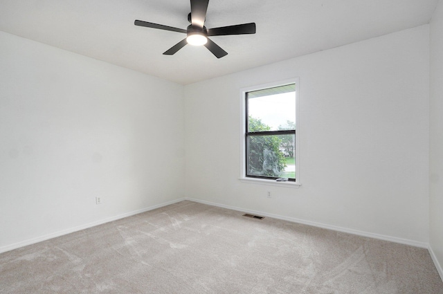 511 W Chestnut Rd, Nixa, MO 65714 - unfurnished room featuring light carpet, baseboards, and a ceiling fan