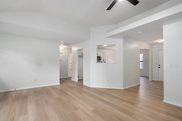 511 W Chestnut Rd, Nixa, MO 65714 - unfurnished room featuring light wood-style flooring, ceiling fan, vaulted ceiling, and baseboards