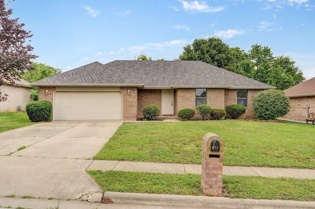 511 W Chestnut Rd, Nixa, MO 65714 - single story home featuring an attached garage, driveway, a front lawn, brick siding, and roof with shingles