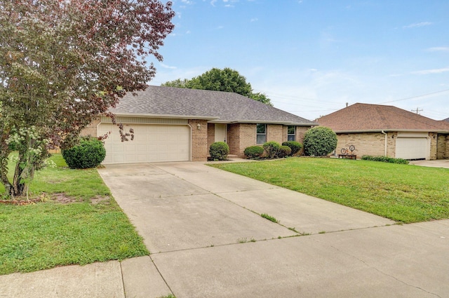 511 W Chestnut Rd, Nixa, MO 65714 - single story home with brick siding, a front yard, a garage, driveway, and a shingled roof