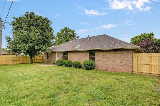 511 W Chestnut Rd, Nixa, MO 65714 - back of property with brick siding and roof with shingles