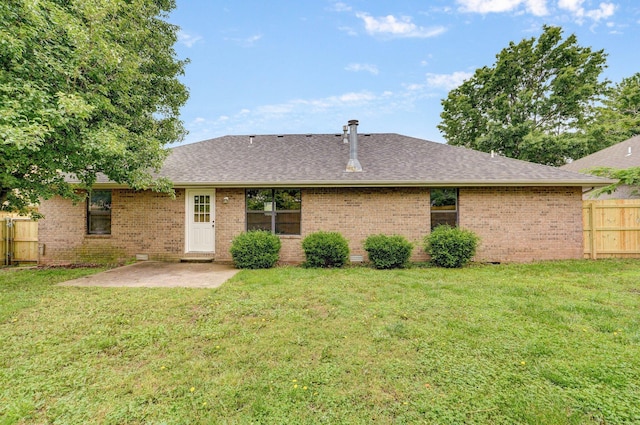 511 W Chestnut Rd, Nixa, MO 65714 - rear view of house with brick siding, a patio, and a shingled roof