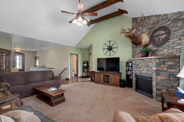 7519 W Farm Rd Unit 194, Republic, MO 65738 - carpeted living room with ceiling fan, a stone fireplace, high vaulted ceiling, and beam ceiling