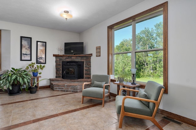 7519 W Farm Rd Unit 194, Republic, MO 65738 - tiled living area with baseboards and a fireplace