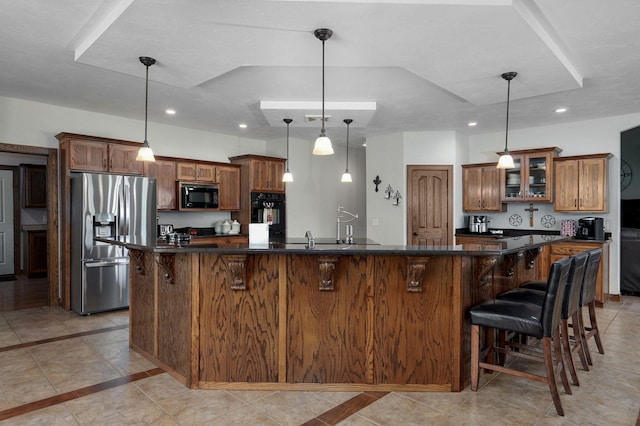 7519 W Farm Rd Unit 194, Republic, MO 65738 - kitchen featuring black appliances, a breakfast bar, brown cabinets, glass insert cabinets, and recessed lighting