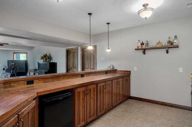 7519 W Farm Rd Unit 194, Republic, MO 65738 - kitchen with wood counters, brown cabinetry, baseboards, and pendant lighting