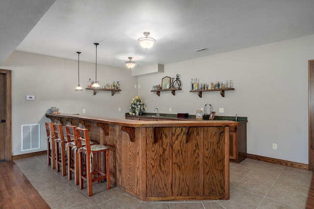 7519 W Farm Rd Unit 194, Republic, MO 65738 - indoor wet bar featuring baseboards and decorative light fixtures