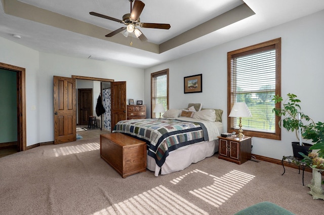 7519 W Farm Rd Unit 194, Republic, MO 65738 - bedroom featuring carpet flooring, baseboards, ceiling fan, and a raised ceiling