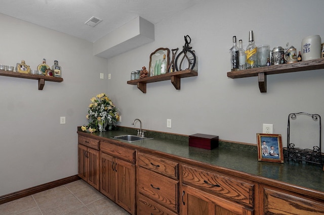 7519 W Farm Rd Unit 194, Republic, MO 65738 - kitchen featuring open shelves, a sink, dark countertops, and brown cabinetry
