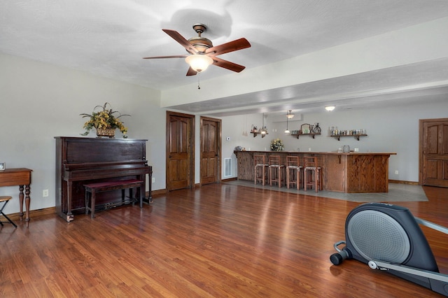 7519 W Farm Rd Unit 194, Republic, MO 65738 - exercise room with bar with sink, wood finished floors, a ceiling fan, and baseboards