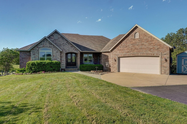 7519 W Farm Rd Unit 194, Republic, MO 65738 - view of front of property with an attached garage, driveway, brick siding, a front yard, and a shingled roof