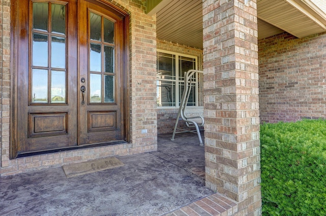 7519 W Farm Rd Unit 194, Republic, MO 65738 - property entrance featuring french doors, a porch, and brick siding