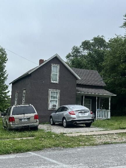 508 W Webster Ave, Ava, MO 65608 - view of property exterior featuring a chimney