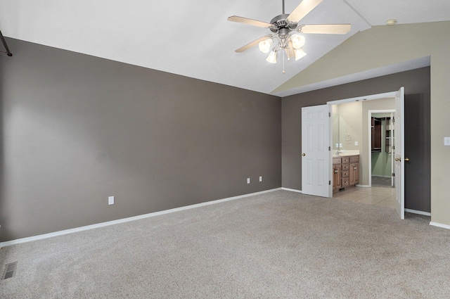 382 S Yellowwood Dr, Springfield, MO 65809 - unfurnished bedroom with light colored carpet, lofted ceiling, baseboards, connected bathroom, and ceiling fan