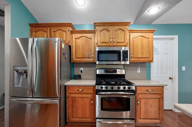 382 S Yellowwood Dr, Springfield, MO 65809 - kitchen with appliances with stainless steel finishes, light countertops, and dark wood finished floors