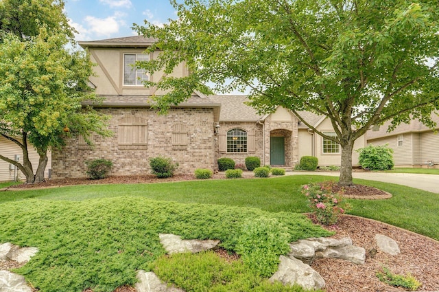 382 S Yellowwood Dr, Springfield, MO 65809 - view of front of home featuring stucco siding, a front yard, a shingled roof, and stone siding