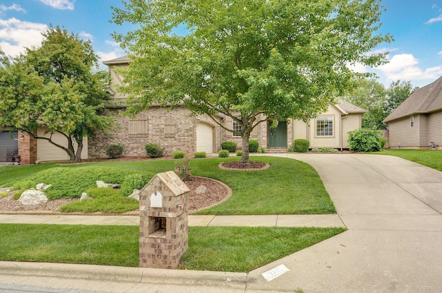 382 S Yellowwood Dr, Springfield, MO 65809 - view of property hidden behind natural elements featuring a garage, a front yard, and concrete driveway