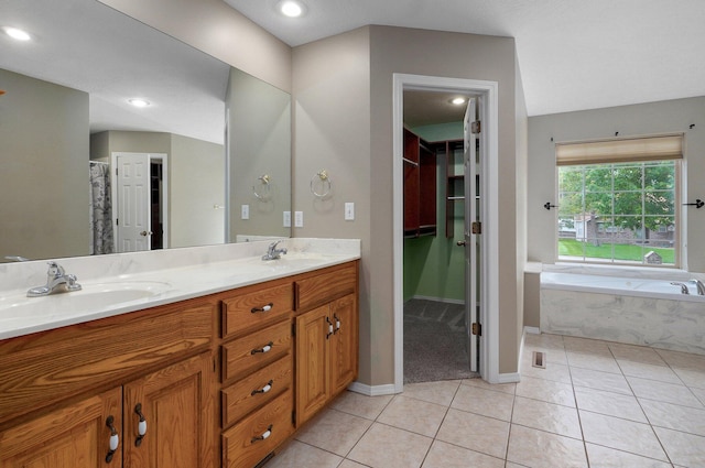 382 S Yellowwood Dr, Springfield, MO 65809 - bathroom featuring tile patterned floors, double vanity, a bath, baseboards, and recessed lighting